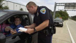 Issuing a speeding ticket through driver's window