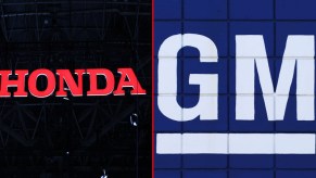 Honda logo (L), GM logo (R).