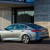 A rear shot of a silver Kia Optima Plug-in Hybrid. The Optima is the most dependable sedan in 2023.