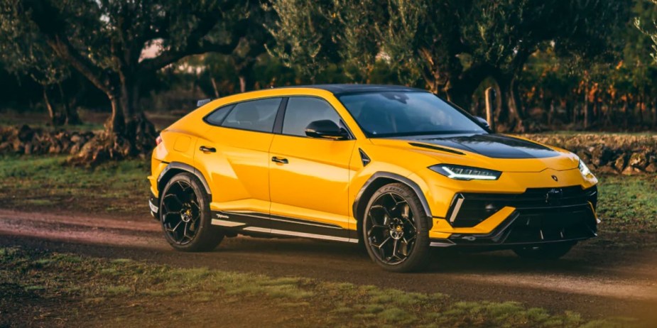 A yellow Lamborghini Urus performance SUV is parked. 