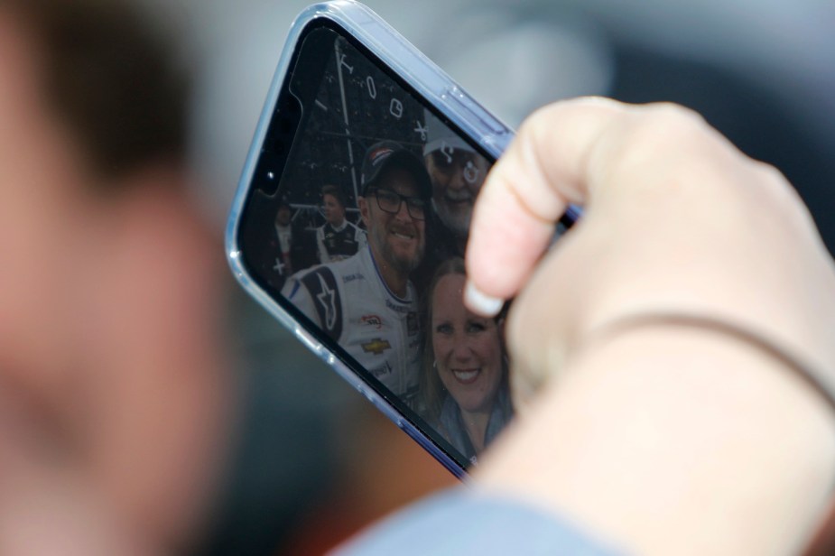 Phone of a NASCAR fan taking a selfie photo with Dale Earnhardt Jr.