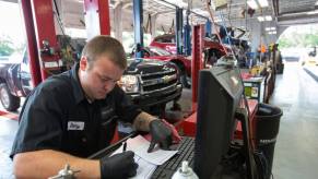 A technician at the Raymond Chevrolet dealership in Antioch, Illinois, working on vehicle recall paperwork