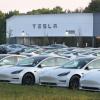 Tesla electric cars on display at a dealership.