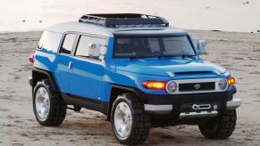 A blue Toyota FJ Cruiser on display.