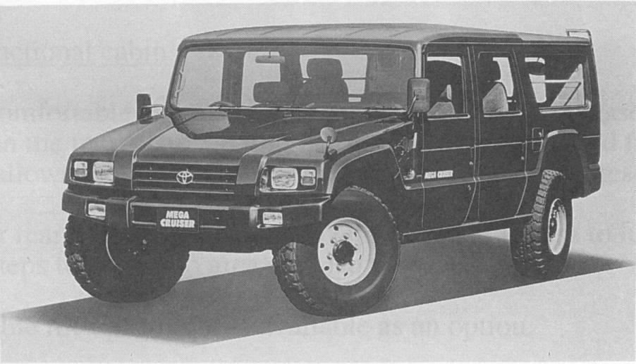 A black and white photo of a Toyota Mega Cruiser.