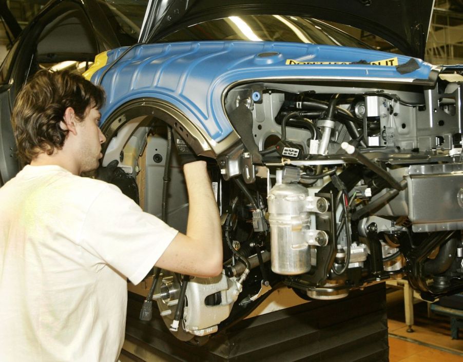 Workers assembling vehicles and differentials at a Volvo car plant in Ghent, Belgium