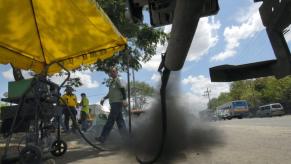 A truck in the Philippines emitting black smoke from its exhaust system during government testing