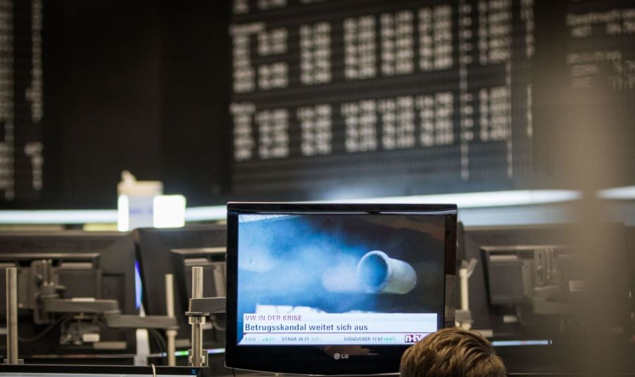 The exhaust pipe of a diesel vehicle emitting blue smoke shown on a computer monitor at a German stock exchange