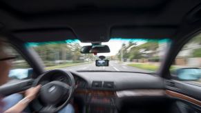 A view out of a windshield from a car being driven