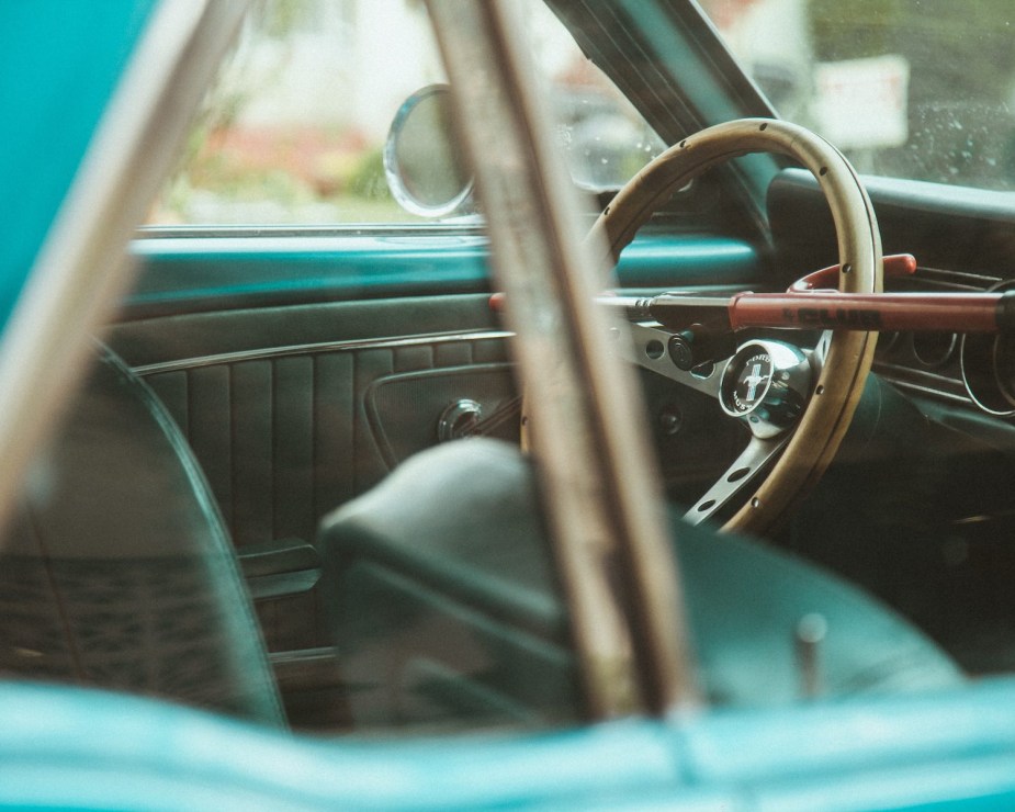 View through the window of a locked Mustang car.