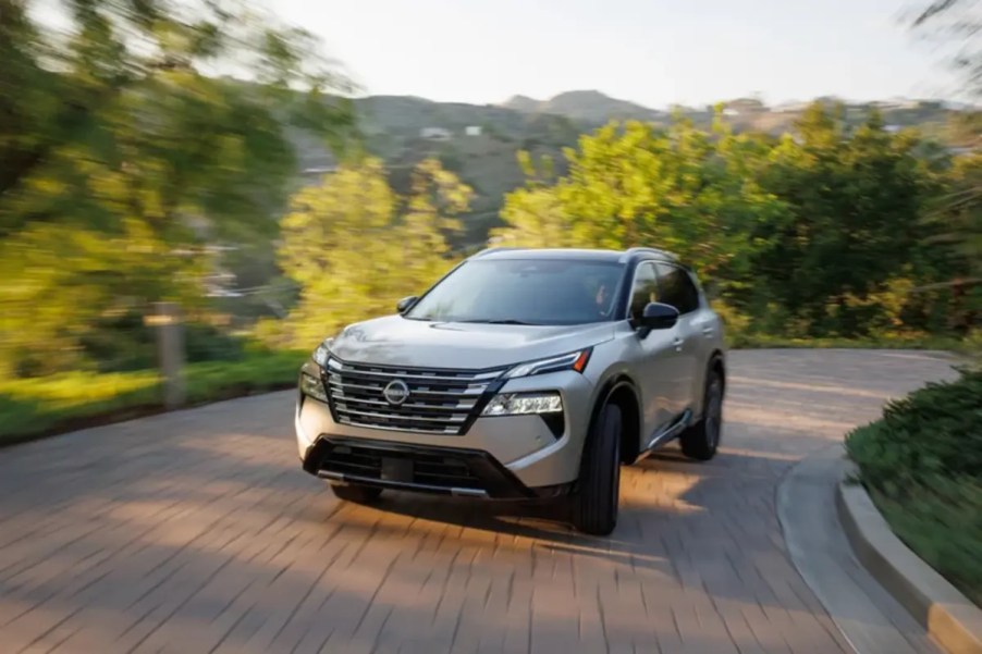 2024 Nissan Rogue driven on country road