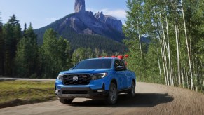 2024 Honda Ridgeline TrailSport carrying a pair of Honda dirt bikes.