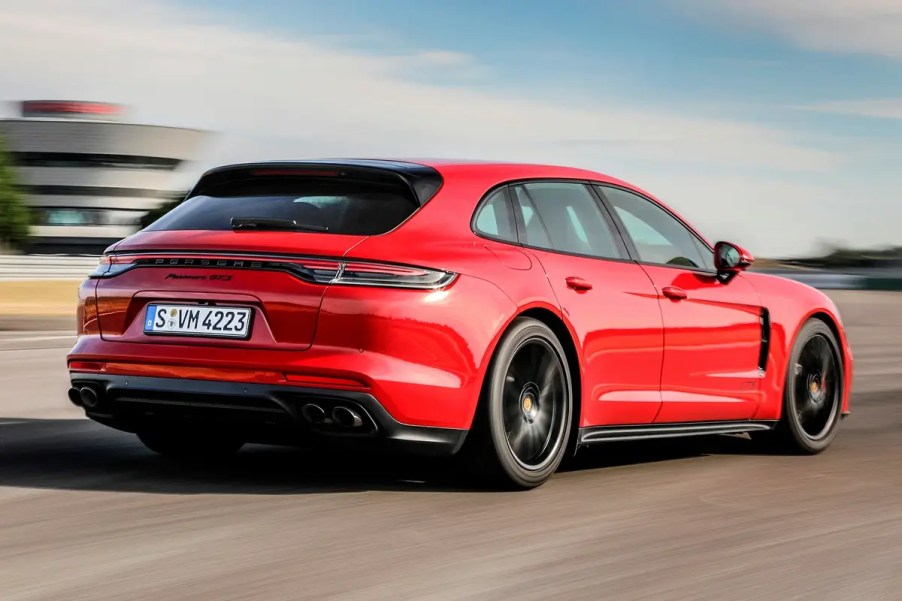 Red 2023 Porsche Panamera Sport Turismo on the track