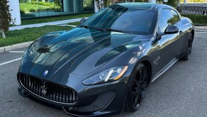 2013 Maserati Granturismo Sport coupe front 3/4 in black sold used for cheap on Cars and Bids