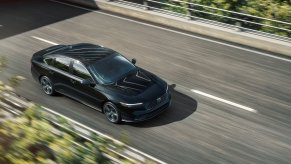 A black Honda Accord, the most common Honda car target for catalytic converter theft, drives on a road.