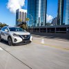 2023 Nissan Murano in white driving on a city highway. The 2023 Nissan Murano's performance makes it well-suited for the task.