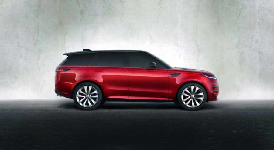 A red 2023 Range Rover Sport on display.