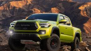 The 2023 Toyota Tacoma climbing over rocks