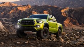 The 2023 Toyota Tacoma off-roading over rocky terrain