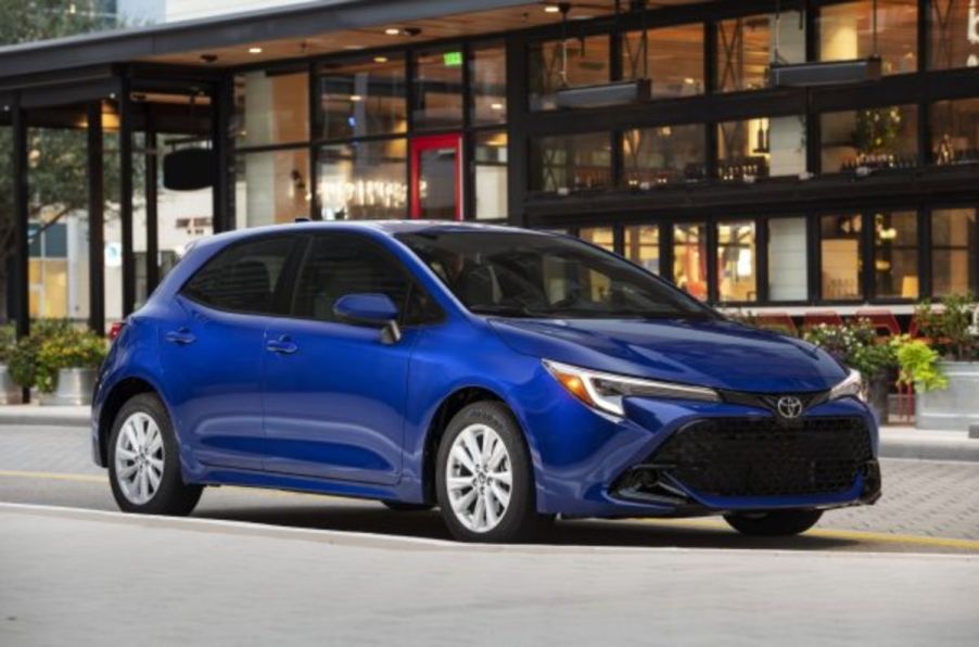 A blue 2023 Toyota Corolla Hatchback on display.