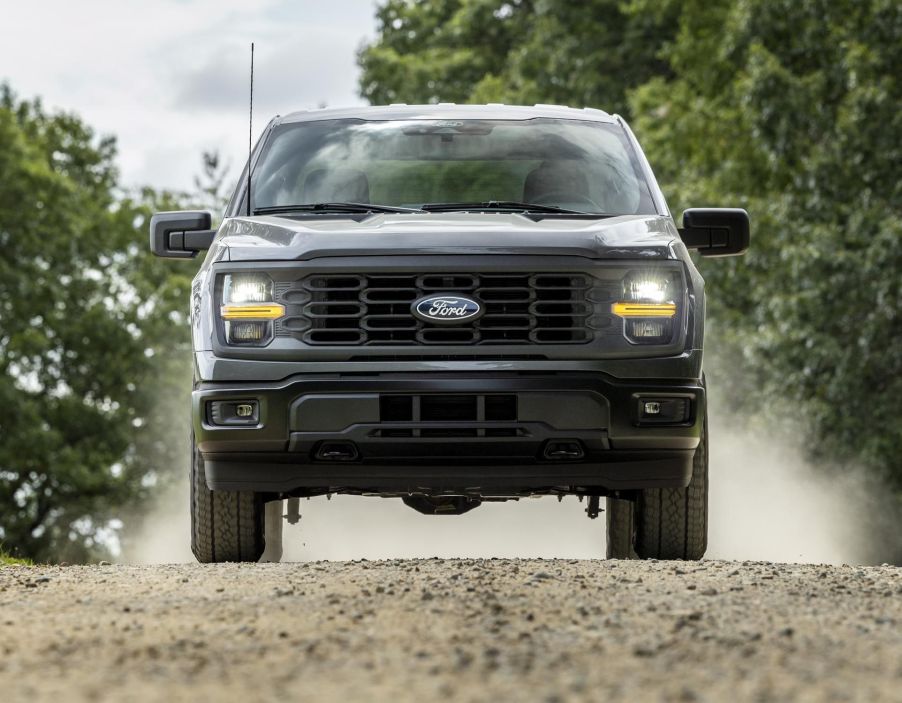 The 2024 Ford F-150 off-roading on a dirt trail