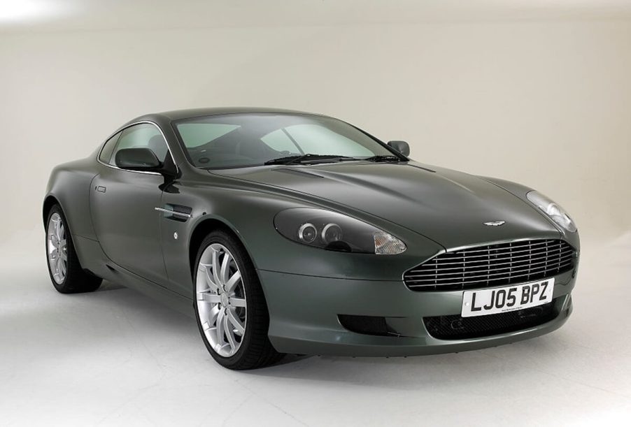 An Aston Martin DB9 GT car, not unlike the DB7 in Johnny English, shows off its touring car lines on a stage.