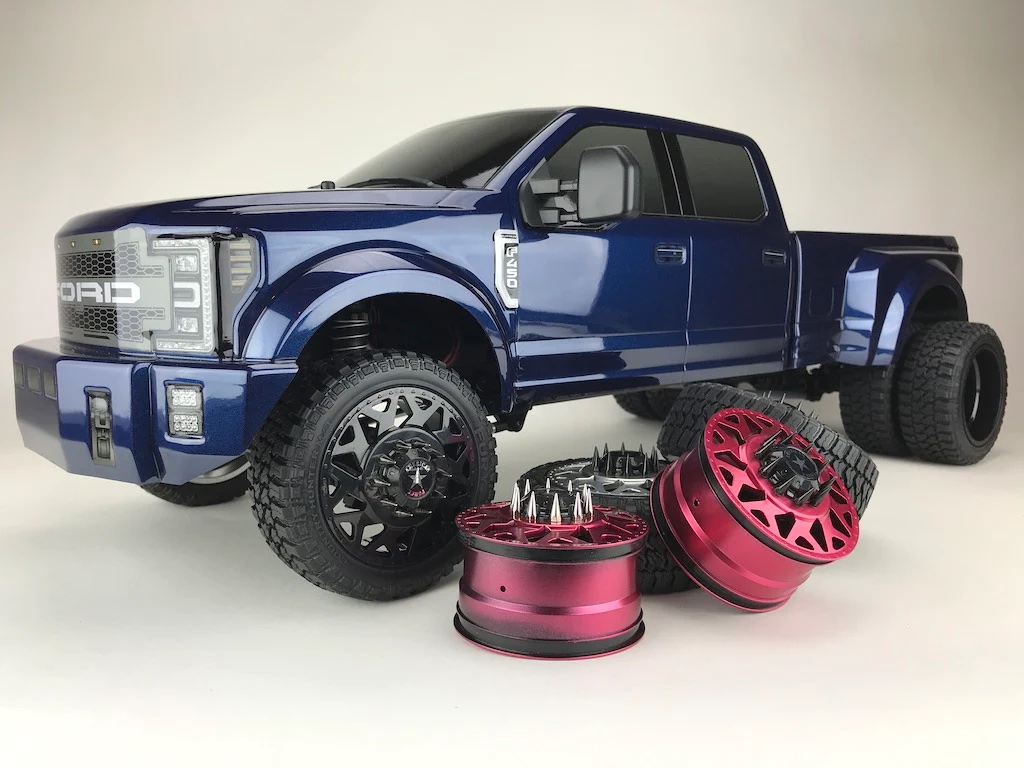 Ford F-450 pickup truck with spiked aftermarket lug nuts on its wheels.