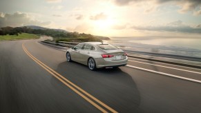 Rear 3/4 view of the 2024 Chevrolet Malibu Premier 1LZ in Mineral Gray Metallic. Chevy Malibu sales are on the upswing.