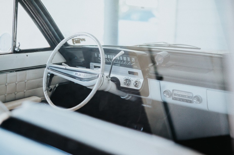 The white interior of a classic Buick car.