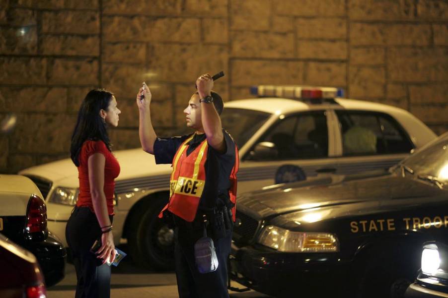 A woman getting tested at a DUI checkpoint.