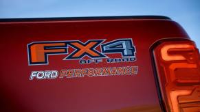 A Ford Ranger midsize pickup truck with FX4 off-road performance package branding on its rear bed