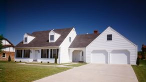 A white home with two large garage doors.