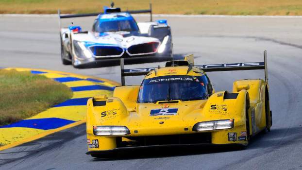 Cars race during the Petit Le Mans race