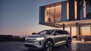 The Lucid Gravity SUV in front of a modern house