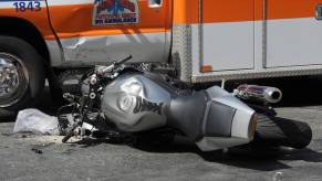 Silver motorcycle crashed into an ambulance.