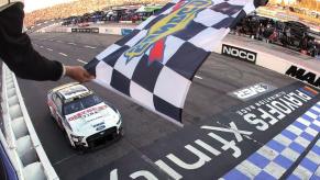 A waving checkered flag at the NASCAR Cup Series Xfinity 500 at Martinsville Speedway in Virginia