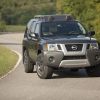 A Nissan Xterra SUV on display on a road.