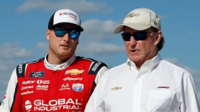 Richard Childress and Austin Hill walk together.