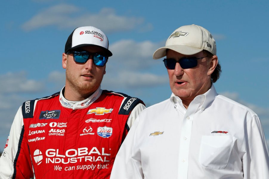 Richard Childress and Austin Hill walk together.