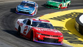 Sheldon Creed races in front of Austin Hill during the NASCAR Xfinity Series Dead On Tools 250 at Martinsville Speedway