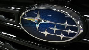 The Subaru logo on the front grille of a Subaru. Customers are very loyal to the Subaru brand.