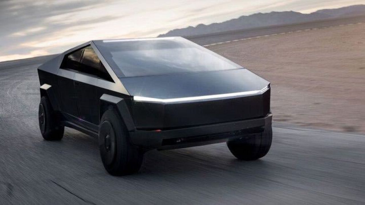 A matte black Tesla Cybertruck on a track