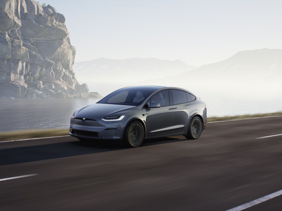 A gray Tesla Model X driving near a cliff. Tesla advertising might start for the Model X.