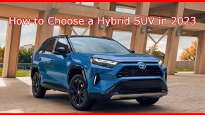 A blue 2024 Toyota RAV4 Hybrid small hybrid SUV is parked.