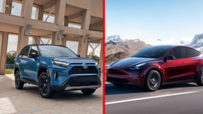 (L) A blue Toyota RAV4 small SUV, (R) a red Tesla Model Y small electric SUV.