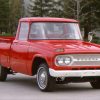 A red Toyota Stout pickup truck on display.