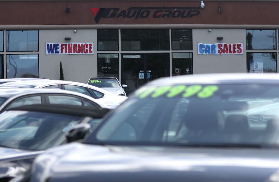 A finance sign at a dealership lot