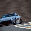 A 2024 Nissan Z NISMO sports car coupe model cornering on a race track course