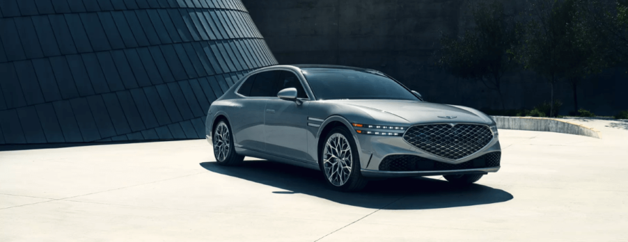 A 2024 Genesis G90 full-size luxury sedan model parked on a concrete plaza