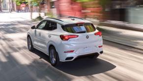 A rear exterior shot of a 2023 Buick Encore GX subcompact SUV model in White Frost Tricoat